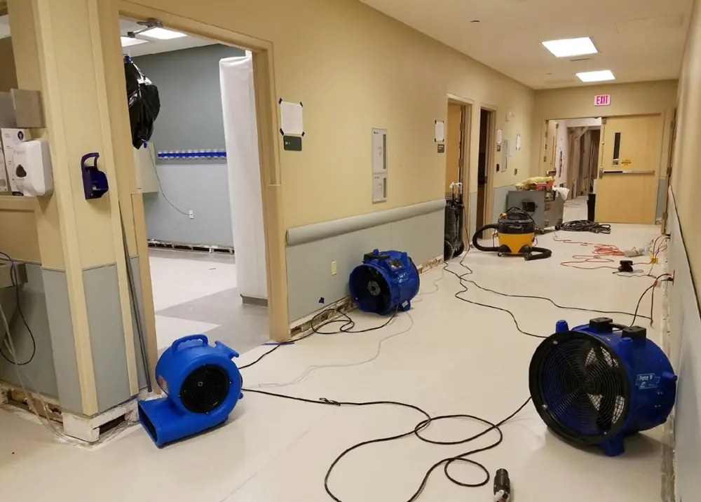 Water damage restoration crew working in JeffVanderLou, MO